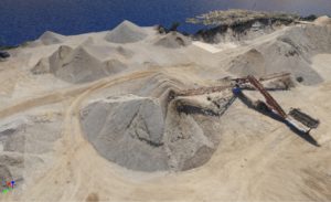 Pile of white sand with conveyor.